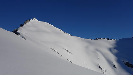 Massive snowfield on upper slopes with the summit of McPherson shown