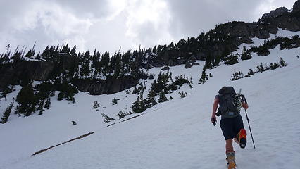 Headed for 6200 foot bench on east ridge (visible at center left)