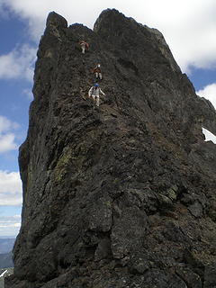 The gang down climbing the summit block.