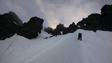 Climbing the large snow arete