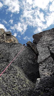 The fun (but short) crux off-width pitch on Burgundy Spire's N Face.